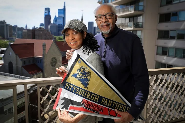 Gloria and Jim Ruffins, holding their college pennants, are fans of the Penn Relays. After every event, they began hosting a party at their house. What started as eight people and pizza has grown to 68 people and a gourmet buffet. They will know life is normal again when the Relays return.