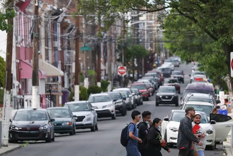 Pedestrians walk along Susquehanna Ave. in the Norris Square neighborhood of Philadelphia on Wednesday, May 11, 2022. Philadelphia released its first property reassessments in three years. Many homeowners are seeing a significant increase.