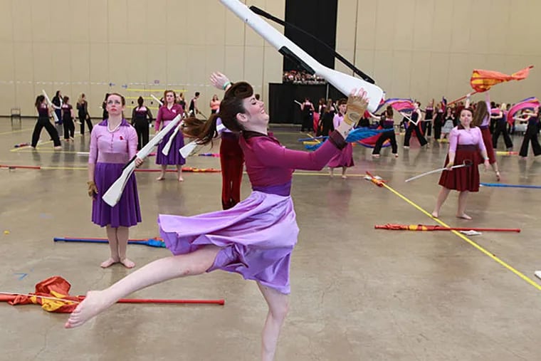 Megan Gross, 22, warms up before the competition. The Tournament of Bands contest drew 233 units from about 125 schools and programs in seven states. DAVID SWANSON / Staff Photographer