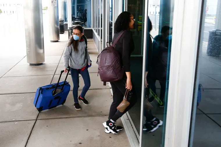 Travelers enter the Atlantic City International Airport on Sun, March 29, 2020.