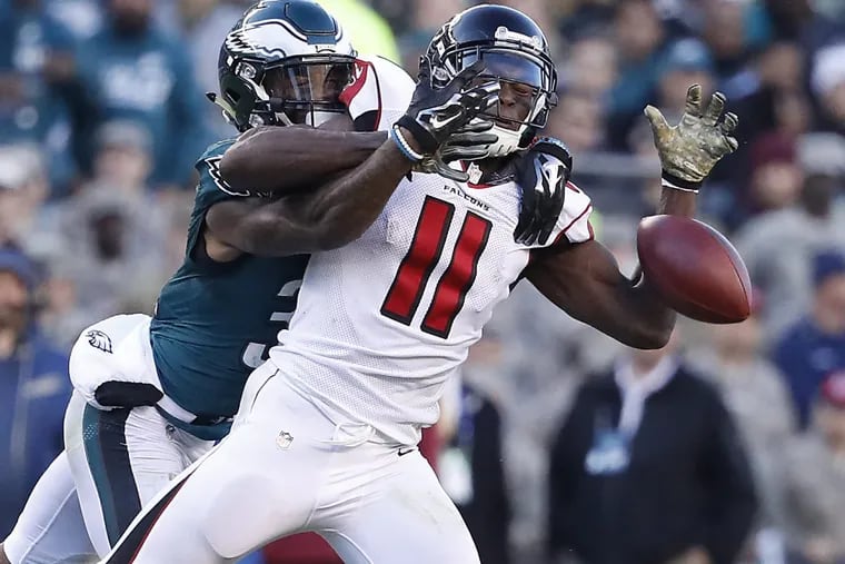 The Eagles’ Jalen Mills, left, was called for pass interference as he defended a pass intended for the Falcons’ Julio Jones during the teams’ meeting in November 2016.