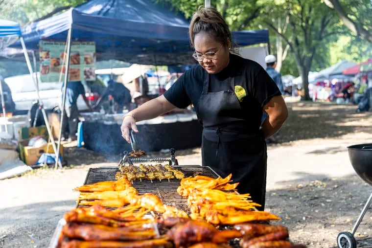 Chanthea Nhep, Owner of Vee’s Kitchen, is cooking and prepping food for people visiting the Southeast Asian Market at FDR Park in Philadelphia, Pa., Saturday, Sept., 17, 2022.