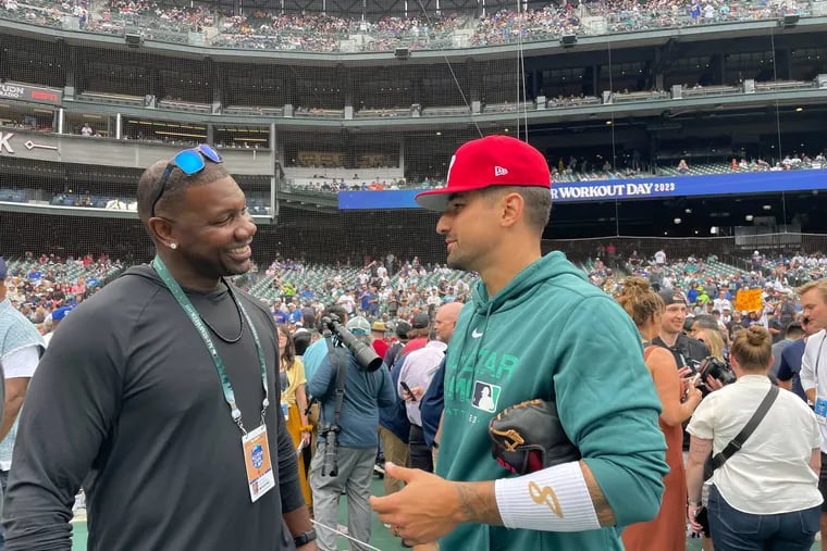 Former Phillies first baseman Ryan Howard talks with Phillies outfielder Nick Castellanos during All-Star Game festivities on Monday in Seattle.
