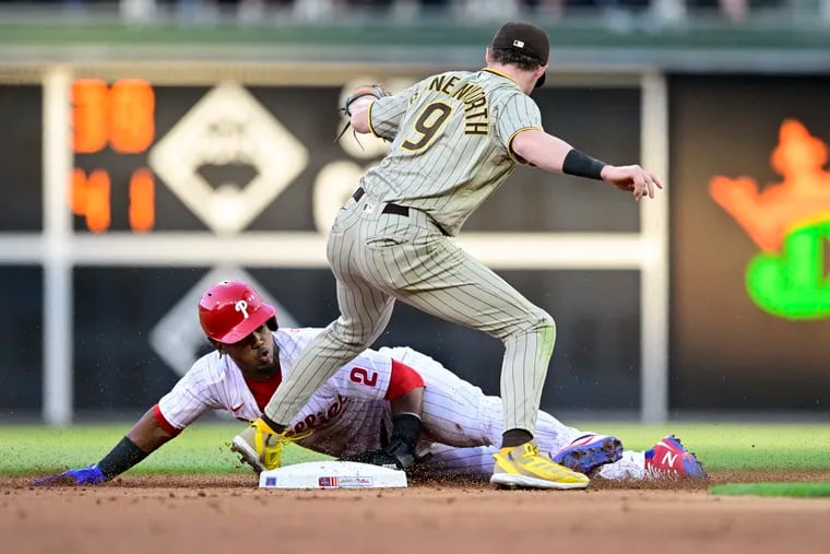 The Phillies' Jean Segura steals second base past the tag of  the Padres' Jake Cronenworth during the second inning.
