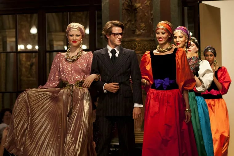Gaspard Ulliel as Yves Saint Laurent with models on the runway during a fashion show. (CAROLE BETHUEL)