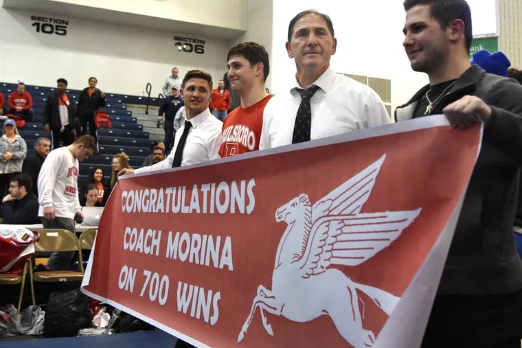 Paulsboro wrestling coach Paul Morina (second from right) celebrates his 700th career win after the team beat Kittatinny 63-3 in the Group 1 state final.