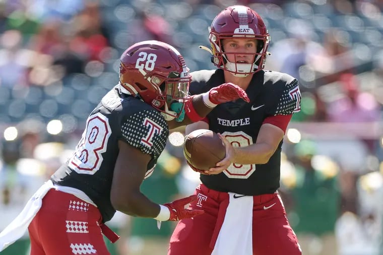 Temple quarterback E.J. Warner hands off to Darvon Hubbard in the first half against Norfolk State at Lincoln Financial Field.