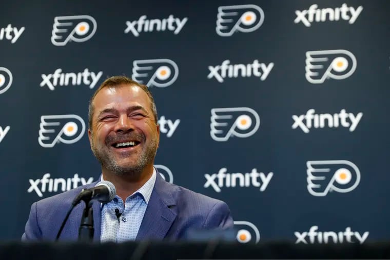 Alain Vigneault was all smiles when he was introduced as the Flyers' new coach last year. He's still smiling.