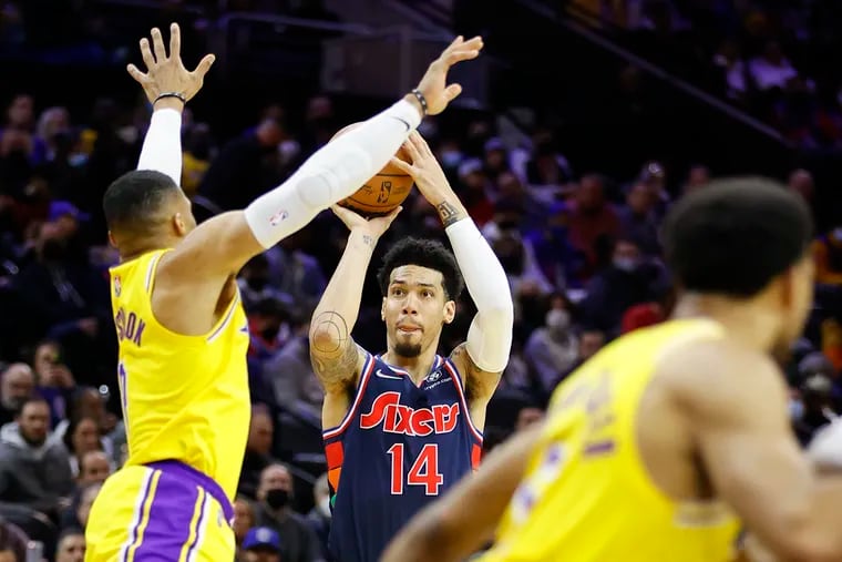 Sixers forward Danny Green shoots the basketball over Los Angeles Lakers guard Russell Westbrook in the second quarter on Thursday, January 27, 2022 in Philadelphia.