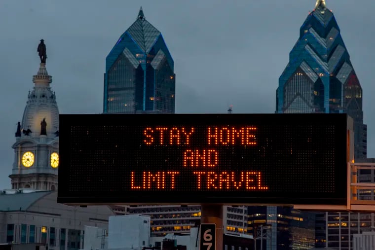 A sign at the 8th Street ramp to westbound I-676 on Mar. 22, 2020 reflects Philadelphia's order that all residents stay in their homes except when engaging in life-sustaining activities because of the coronavirus pandemic.