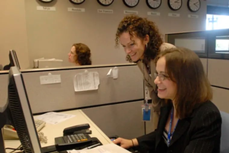 At Lockheed Martin&#0039;s Lifetime Command Support Center for aircraft tires in Moorestown, logistics analysts Peggy Thornton (left) and Sandy Ebenhoech work.