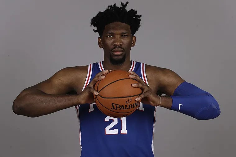 Philadelphia 76ers’ Joel Embiid poses for a photograph during media day at the NBA basketball team’s practice facility, Monday, Sept. 25, 2017, in Camden, N.J.