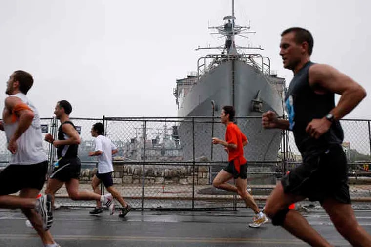 File photo of runners entering the Navy Yard in South Philadelphia at the end of the Broad Street Run. The finish line has been moved this year to Pattison Avenue.