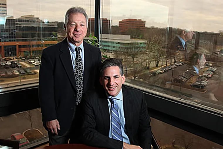 Lawyers Joe Manko, left and Robb Fox in their Bala Cynwyd office. (Laurence Kesterson / Staff Photographer)