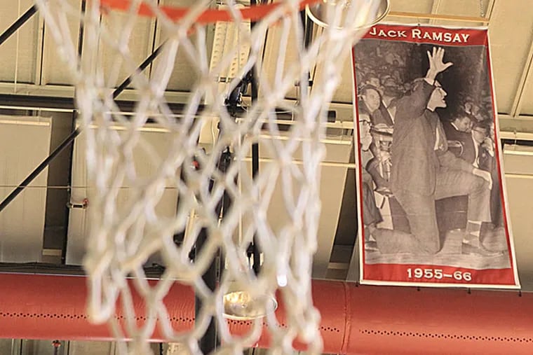 A banner for Dr. Jack Ramsay hangs in Hagan Arena at Saint Joseph's. (Charles Fox/Staff Photographer)