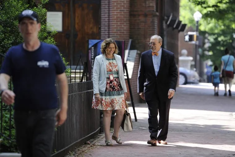 Lancaster Mayor Richard Gary walks with Lancaster director of public works Charlotte Katzenmoyer down a historic section of Duke Street. City officials fear what would happen to Lancaster if Mobilitie LLC had access to it sidewalks for small-cell antenna poles.