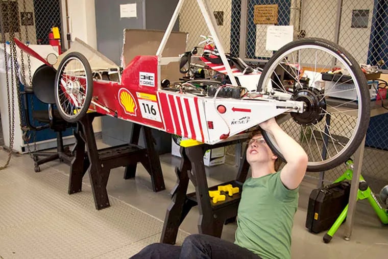 Swarthmore junior Neil Macfarland works on a vehicle that will contest the Shell Eco-marathon.