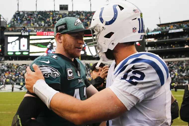 Carson Wentz greets his Colts counterpart Andrew Luck after Wentz and the Eagles took down Indianapolis on Sunday.