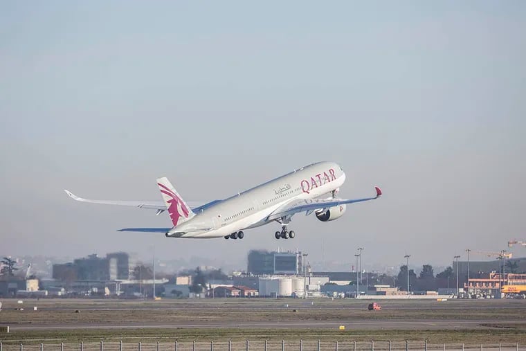 Qatar Airways Ltd.'s first Airbus A350 passenger aircraft takes off following a delivery ceremony at the Airbus Group NV factory in Toulouse, France, on Dec. 22, 2014. ( Balint Porneczi / Bloomberg )