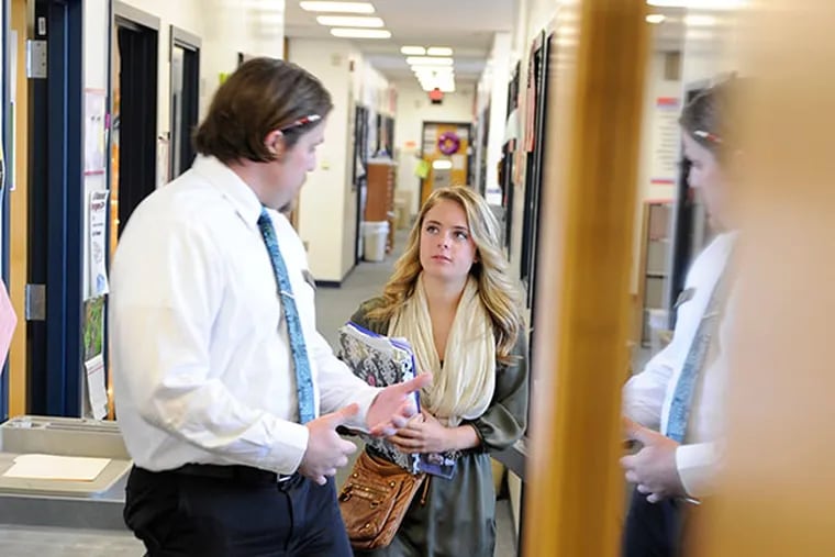 Rider University admissions counselor Ed Stone (left) walks back to the room for an interview with Washington Township High School senior Katelyn Zemlak before he offered her instant acceptance during a visit to her school November 13, 2013. ( TOM GRALISH / Staff Photographer )