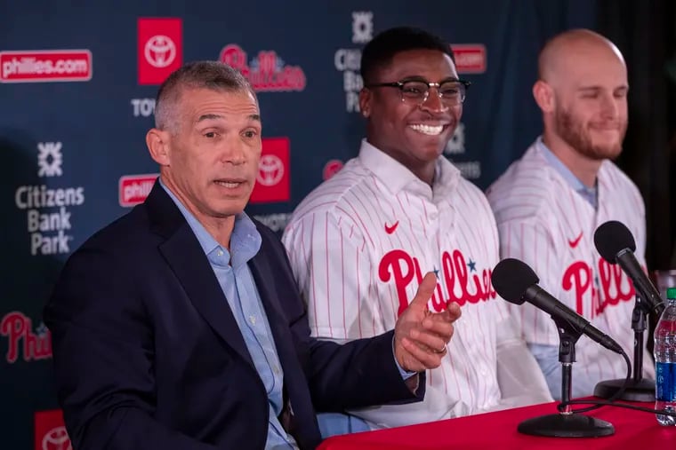 New Phillies manager Joe Girardi, left, talks about the two new Phillies, shortstop Didi Gregorius, center, and pitcher Zack Wheeler.