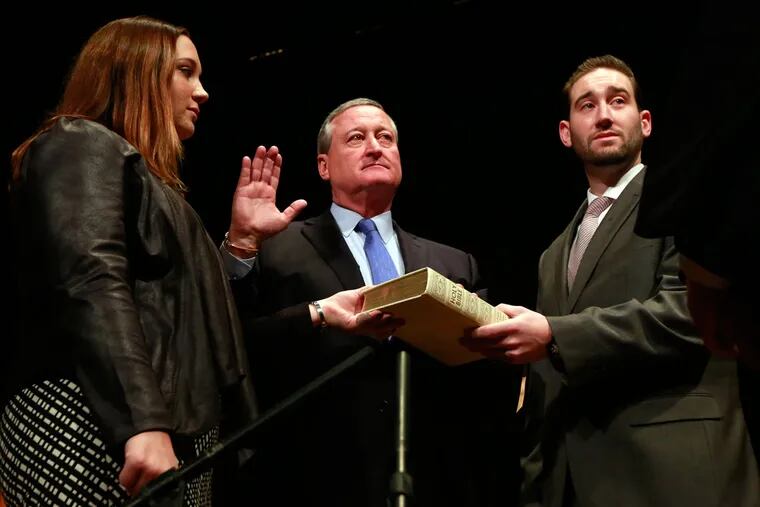 Mayor Jim Kenney is administered the oath of office by Judge Kevin Dougherty with Kenney's children Nora, 21, and Brendan, 26, during his inauguration at the Academy of Music on Monday, Jan. 4, 2016.