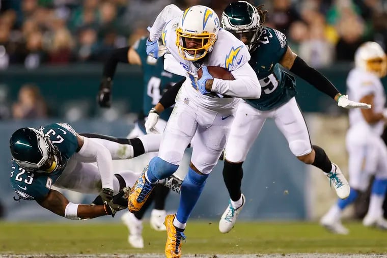 Los Angeles Chargers wide receiver Keenan Allen runs with he football past Eagles safety Rodney McLeod (left) and  cornerback Avonte Maddox in the third quarter on Sunday, November 7, 2021 in Philadelphia.