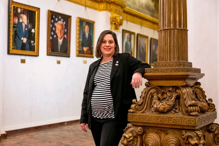 State Sen. Amanda Cappelletti outside her office in the Capitol on Jan. 17. She is expecting her first child in March, becoming the state’s first sitting senator to give birth while in office.