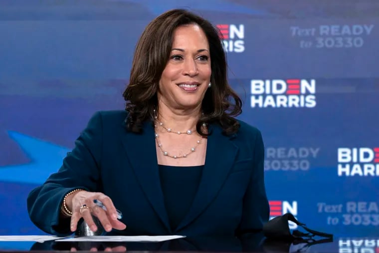 Democratic presidential candidate former Vice President Joe Biden’s running mate Sen. Kamala Harris (D., Calif.) looks up as she signs required documents for receiving the Democratic nomination for president and vice president of the United States in Wilmington, Del.