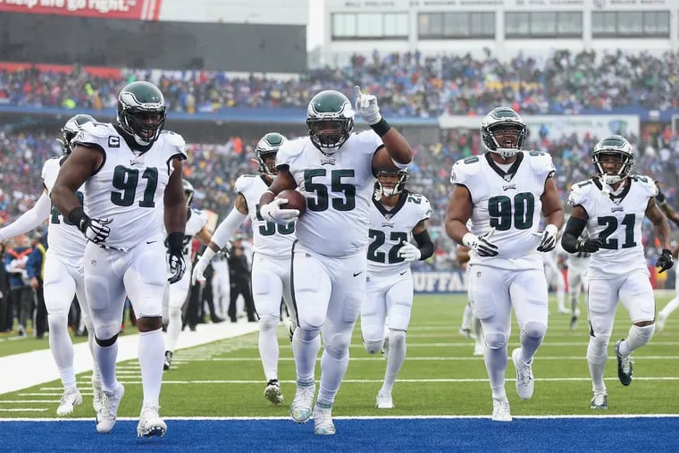 Brandon Graham (55) and teammates celebrate after he recovered a fumble during the second quarter of the Eagles' win over the Bills.
