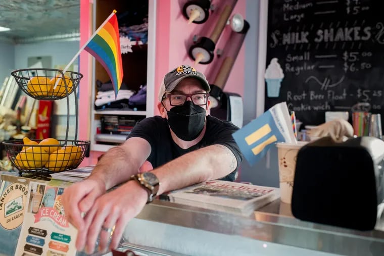 James Lamb, 43, the owner of Evolution Candy, takes a break inside the shop in Doylestown