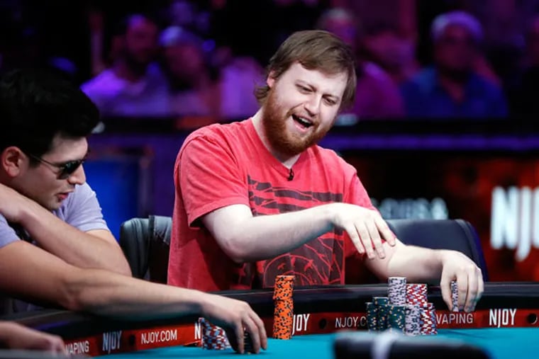 Joe McKeehen of North Wales smiles after winning a pot at the World Series of Poker tournament Tuesday. The final rounds of the contest will be in November. A Marlton man is also a contender. (JOHN LOCHER / AP)