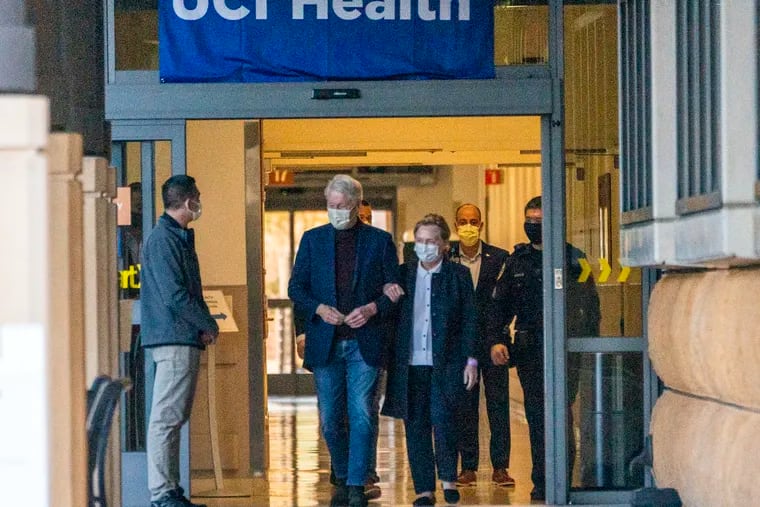 Former President Bill Clinton and former U.S. Secretary of State Hillary Clinton leave the University of California Irvine Medical Center in Orange, Calif., on Sunday.
