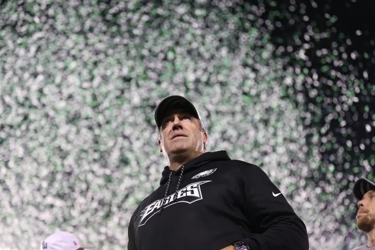 Eaglesâ€™ head coach Doug Pederson looks out over the crowd as confetti falls after the Philadelphia Eagles win 38-7 over the Minnesota Vikings to win the NFC Championship game in Philadelphia, PA on January 21, 2018. DAVID MAIALETTI / Staff Photographer