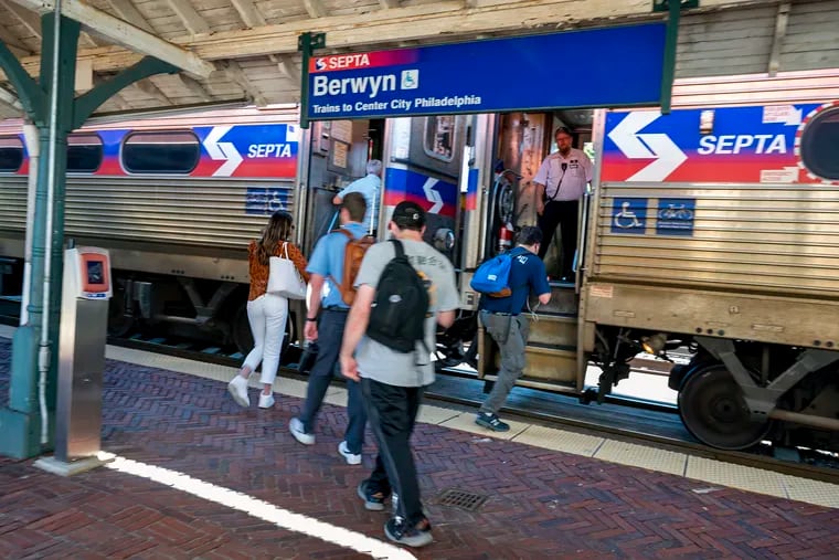 Commuters boarding a SEPTA Regional Rail train on the Paoli/Thorndale Line at the Berwyn Station earlier this month.