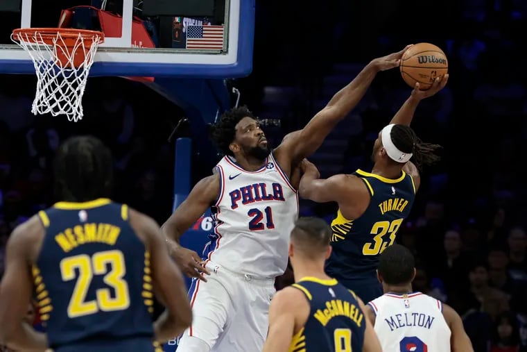 Joel Embiid of the Sixers blocks a shot by the Pacers' Myles Turner in the second quarter Sunday night.