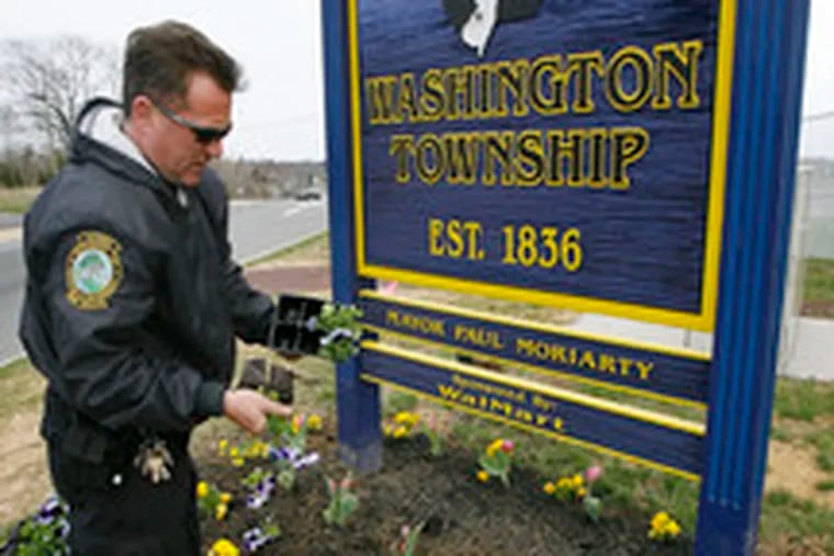 Park Ranger Tom Carlson plants flowers in Washington Township, Gloucester County, one of six similarly named municipalities in N.J. There are four Franklins, and at least a pair of Springfields.