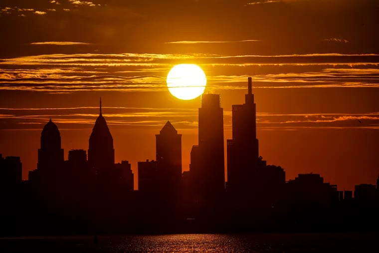 The sun sets on Philadelphia as seen from Pennsauken New Jersey on Thursday.