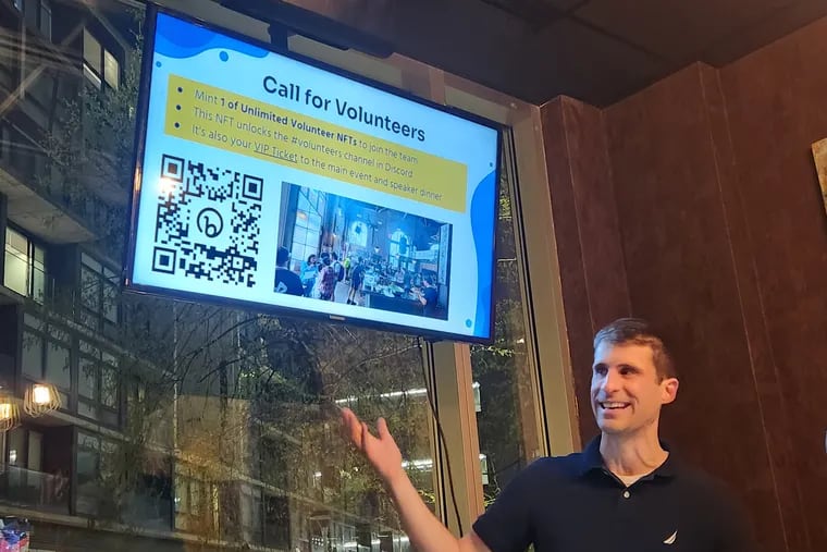 Michael Ghen, the leader of DeFi Philly, talks decentralized finance and blockchain technology at a meet up in Northern Liberties.