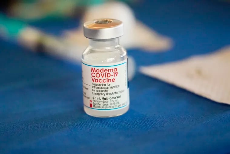 A vial of Moderna COVID-19 vaccine on a table at an inoculation station in Jackson, Miss.