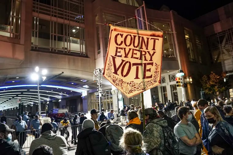 Demonstrators demanding for officials to "COUNT EVERY VOTE" rally outside the Pennsylvania Convention Center where votes are being counted, Thursday, Nov. 5, 2020, in Philadelphia.