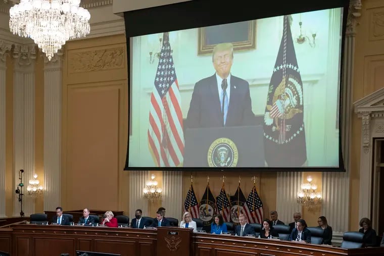 A video of President Donald Trump is shown on a screen, as the House select committee investigating the Jan. 6 attack on the U.S. Capitol holds a hearing.