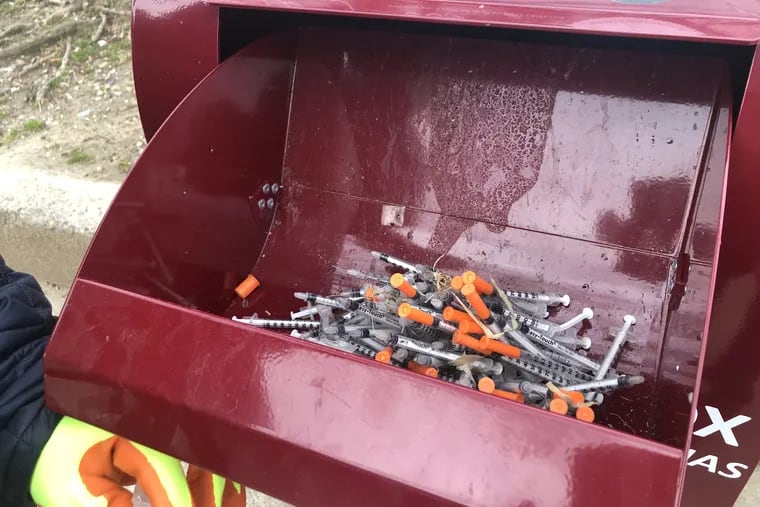 The city has installed numerous sharp boxes to collect used needles. One box sits right outside McPherson Square Park.