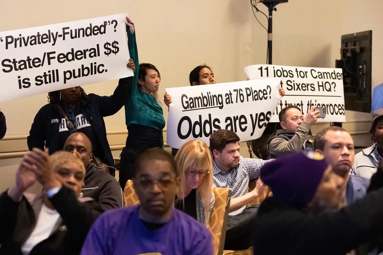 The Sixers invited the public to come and ask questions about their proposed 76er Place project on East Market Street Thursday night. Those who brought signs in opposition to the arena were initially escorted out until David Adelman, 76er co-owner and chairman of 76 Development Company, allowed them to stay.