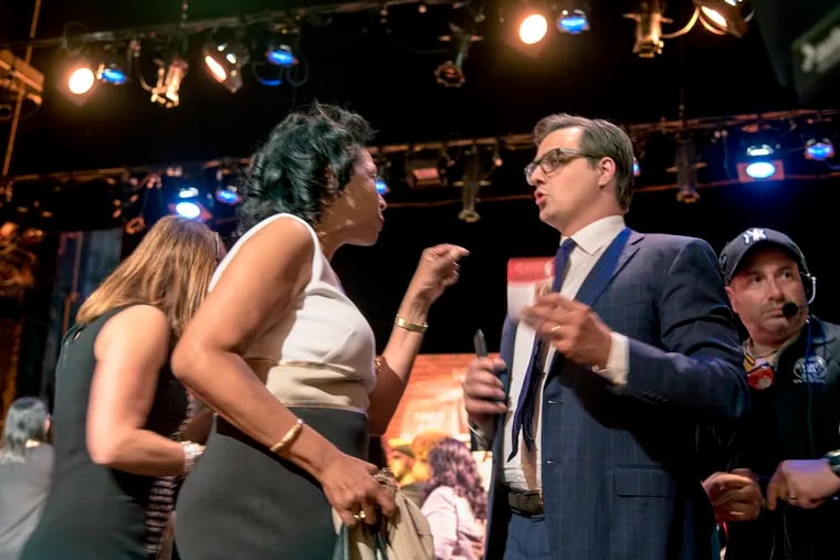 Tanzie Youngblood (left), Democratic primary candidate in New JerseyÕs 2nd Congressional District, buttonholes MSNBC host Chris Hayes (right) as he leaves the stage at the Prince Theater May 29, 2018 following the taping of a show, "Everyday Racism in America" he hosted with Joy Reid, an hour-long town hall focused on race relations in America. TOM GRALISH / Staff Photographer 