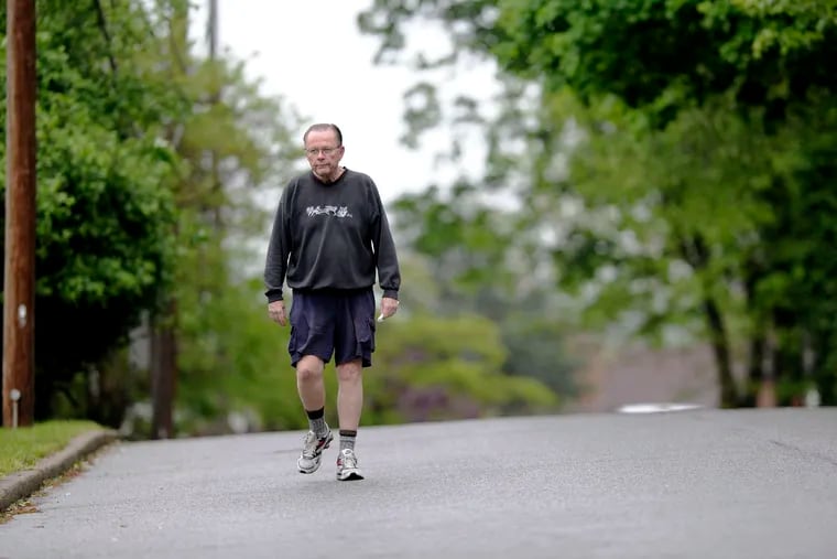 Battling Alzheimer’s, Inquirer sports columnist emeritus Bill Lyon took his daily walk around his Broomall neighborhood in May 2016.