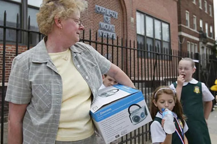 Teacher Joan Weeney leaves Our Lady of Mount Carmel, where she has taught for 35 years. DAVID MAIALETTI / Staff Photographer