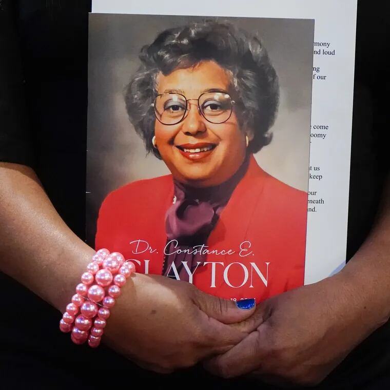 A funeral goer holds a program at the funeral with a photo of Dr. Constance E. Clayton, the first Black and first female Philadelphia superintendent, at the African Episcopal Church of St. Thomas, in Philadelphia, Thursday.