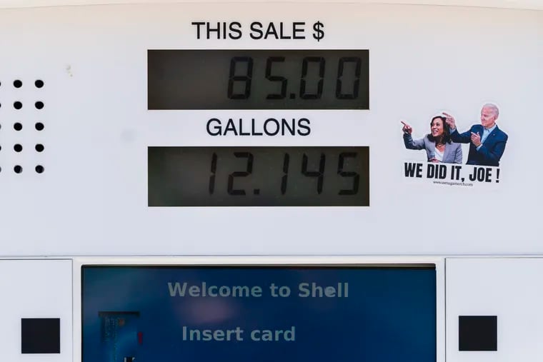 A political sticker mocking President Joe Biden and Vice President Kamala Harris is seen next to a gas pump display showing a transaction in Los Angeles, Monday, March 7, 2022. The price of regular gasoline broke $4 per gallon on average across the U.S. on Sunday for the first time since 2008. (AP Photo/Jae C. Hong)