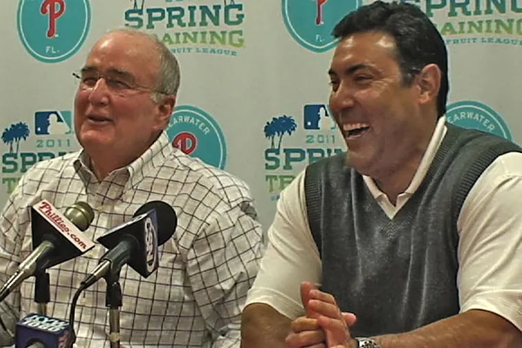 Happier times: General manager Ruben Amaro Jr. (right) with Phillies president David Montgomery in 2010. Amaro is under contract through 2015.